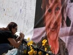 Catalina Ochoa visits a memorial for Nancy Guthrie in front of the KVOA news station on March 3.