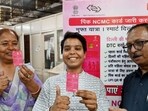 Women receiving the pink cards at Scindia House near CP on Tuesday. (Arvind Yadav/Hindustan Times)
