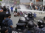 Riot police using a water cannon on protesters outside Parliament in Nepal to disperse crowds