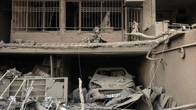 A photograph shows the damage at a residential building near Niloufar square in Tehran during the ongoing joint US-Israeli military campaign on Iran on March 2, 2026. The United States and Israel launched strikes against Iran on February 28, killing Iran's supreme leader and top military leaders, prompting authorities to retaliate with strikes on Israel and across the Gulf. (Photo by AFP) (AFP) A photograph shows the damage at a residential building near Niloufar square in Tehran during the ongoing joint US-Israeli military campaign on Iran on March 2, 2026. The United States and Israel launched strikes against Iran on February 28, killing Iran's supreme leader and top military leaders, prompting authorities to retaliate with strikes on Israel and across the Gulf. (Photo by AFP) (AFP)