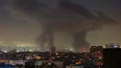 Plumes of smoke rise following reported explosions in Tehran early on March 3, 2026. The United States and Israel started striking Iran on February 28, killing Iran's supreme leader and top military leaders, and prompting authorities to retaliate with strikes on Israel and across the Gulf. (Photo by ATTA KENARE / AFP) (AFP) Plumes of smoke rise following reported explosions in Tehran early on March 3, 2026. The United States and Israel started striking Iran on February 28, killing Iran's supreme leader and top military leaders, and prompting authorities to retaliate with strikes on Israel and across the Gulf. (Photo by ATTA KENARE / AFP) (AFP)