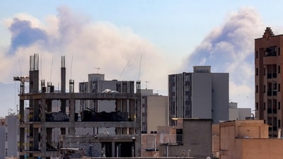 Plumes of smoke rise following reported explosions in Tehran on March 3, 2026. The United States and Israel started striking Iran on February 28, killing Iran's supreme leader and top military leaders, and prompting authorities to retaliate with strikes on Israel and across the Gulf. (Photo by ATTA KENARE / AFP) (AFP) Plumes of smoke rise following reported explosions in Tehran on March 3, 2026. The United States and Israel started striking Iran on February 28, killing Iran's supreme leader and top military leaders, and prompting authorities to retaliate with strikes on Israel and across the Gulf. (Photo by ATTA KENARE / AFP) (AFP)