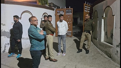 Jhajjar ACP Anil Kumar inspects the crime scene with his team after a woman was shot dead in Biradhana village on Monday night. (Manoj Dhaka/HindustanTimes)