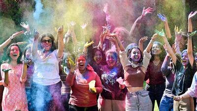 Students playing Holi at Panjab University campus in Chandigarh on Tuesday. (Ravi Kumar/HT)