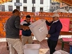 Nepal General Election 2026 highlights: Polling officials check ballot boxes as they prepare a booth on the eve of Nepal's parliamentary elections in Kathmandu on March 4, 2026. 