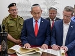 Israel's Prime Minister Benjamin Netanyahu at a reading of the Book of Esther, last night, together with National Security Minister Itamar Ben-Gvir on March 3.
