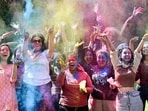Students playing Holi at Panjab University campus in Chandigarh on Tuesday. (Ravi Kumar/HT)