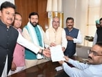 BJP candidate Sanjay Bhatia, fourth from left, filing his nomination for the Rajya Sabha elections in the presence of Haryana chief minister Nayab Singh Saini in Chandigarh on Thursday. (HT Photo)
