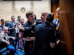 A protester dressed in a military uniform gets stuck in a door, injuring his arm, as Sen. Tim Sheehy (R-MT) (R) and U.S. Capitol Police officers attempt to remove him from a Senate Armed Services Subcommittee hearing on Capitol Hill on March 4, 2026 in Washington, DC. 