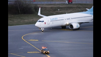 An aircraft carrying passengers evacuated from the Middle East, routed from Muscat via Hurghada, arrives at Luxembourg Airport amid the U.S.-Israeli conflict with Iran. (REUTERS)