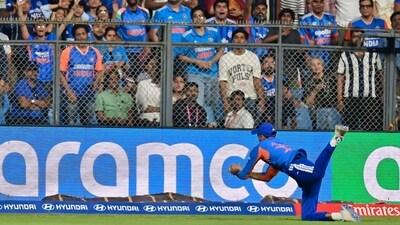 Axar Patel made the difference early on – Jasprit Bumrah's slower one to Harry Brook was chipped high into the air, but the all-rounder tracked it down with extreme precision. His controlled dive with eyes on the ball ended with him hanging on, a terrific catch to give them a key wicket. (Anshuman Poyrekar/HT Photo)