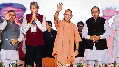 Uttar Pradesh CM Yogi Adityanath at the inauguration of a hospital in Greater Noida on Thursday in the presence of former Indian cricket captain Kapil Dev and others. (Sunil Ghosh/HT)