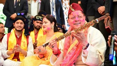 Pushkar Singh Dhami participates in a Holi Milan programme with folk artists at the chief minister’s residence in Dehradun. Pushkar Singh Dhami participates in a Holi Milan programme with folk artists at the chief minister’s residence in Dehradun.