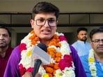 Anuj Agnihotri speaks to the media as he secures first rank in UPSC (Union Public Service Commission) civil services examination 2025, in Chittorgarh on Friday. 