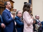 Kristi Noem, center, husband, Bryon Norm, left, at a ​House Judiciary Committee hearing