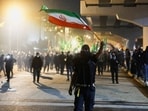 US Iran ‘war’ news highlights: A protester holds an Iranian flag as supporters of Iraqi Shi'ite armed groups attempt to move toward the U.S. embassy located in Baghdad's Green Zone, while riot police deploy to block their advance, following the Israel and U.S. strikes on Iran and the killing of Iran’s Supreme Leader, in Baghdad, Iraq, March 1, 2026.