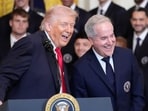 President Donald Trump smiles with Inter Miami CF owner Jorge Mas Santos as he speaks at an event