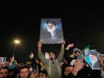 Iraqi Shiites hold pictures of Iranian supreme Leader Ayatollah Ali Khamenei, who was killed by a U.S. airstrike in Tehran, during a symbolic funeral in Baghdad, Iraq, Friday, March 6, 2026. (AP Photo/Hadi Mizban)