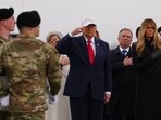 President Donald Trump salutes as an Army carry team moves the flag-draped transfer case containing the bodies of one of the US soldiers killed during the Iran conflict. 