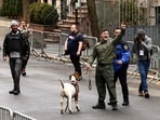 Far-right influencer Jake Lang holds a goat on a leash during the New York protest where a bomb was allegedly hurled at him.
