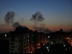 Plumes of smoke rise as strikes hit the city during the US–Israeli military campaign in Tehran, Iran, Friday night