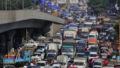 Thane, India - December. 16, 2016:Traffic jam on GB Road -Traffic at Ghodbunder Road was thrown out of gear as a heavy motor vehicle container coming from Gujarat turned at 4.30 am on Majiwada Flyover,container was coming from Gujarat and was heading towards JNPT.The incident resulted in heavy traffic jam and traffic towards Mumbai and Nashik moved at snailÕs pace. The bridge had to be closed down to clear the container , India,Friday December. 16, 2016.(Photo by Praful Gangurde/Hindustan Times) (Praful Gangurde)