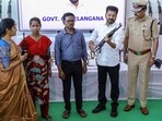 A surrendered Maoist commando handed over his weapon to Telangana chief minister Revanth Reddy at the event in Hyderabad on Saturday. (PTI)