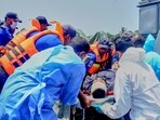 Sri Lankan Navy sailors take one of the injured Iranian sailors from IRIS Dena warship to hospital after their ship sank outside Sri Lanka's territorial waters, in Galle, Sri Lanka,