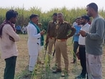 Dudhwa buffer zone officials talking to villagers after a tiger attack resulted in a human fatality in the Sampurnanagar range on Saturday. (HT PHOTO)