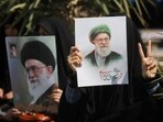 FILE PHOTO: A woman gestures while holding an image of Iran's late Supreme Leader Ayatollah Ali Khamenei, on the day of an anti-Israeli and U.S. rally, amid the U.S.-Israeli conflict with Iran, in Tehran.