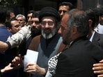 FILE - Mojtaba Khamenei, the son of Iranian Supreme Leader Ayatollah Ali Khamenei, center, attends the annual Quds, or Jerusalem Day rally 