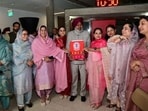 Punjab finance minister Harpal Singh Cheema being welcomed by women AAP MLAs as he arrives to present the state budget in the Vidhan Sabha on International Women’s Day on Sunday.