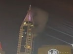 Videos circulating on social media sites showed smoke rising out of the tower in Dubai, distressing residents.