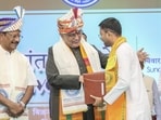 Vice President CP Radhakrishnan (centre) presents a degree to a newly graduated student of the Tripura University in Agartala on Sunday. (PTI) Vice President CP Radhakrishnan (centre) presents a degree to a newly graduated student of the Tripura University in Agartala on Sunday. (PTI)