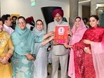 Women MLAs of Punjab welcoming finance minister Harpal Singh Cheema on the budget day at vidhan sabha in Chandigarh on Sunday. (Ravi Kumar / HT)