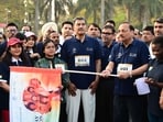Chief Justice of India Justice Surya Kant flaging off a walkathon celebrating International Women’s Day at Sukhna Lake on Sunday. (Keshav Singh/HT)