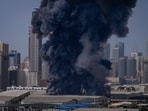 A black plume of smoke rises from a warehouse in the industrial area of Sharjah City following reports of Iranian strikes in Dubai on 1 March 2026.