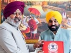 Punjab chief minister Bhagwant Mann with finance minister Harpal Singh Cheema in assembly, Chandigarh, on Sunday. (ANI) Punjab chief minister Bhagwant Mann with finance minister Harpal Singh Cheema in assembly, Chandigarh, on Sunday. (ANI)