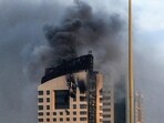 US Iran war news LIVE updates: Smoke rises from a high-rise building following a drone attack in Kuwait City amid the escalation conflict between the US, Israel and Iran.