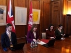 Britain's Chancellor of the Exchequer Rachel Reeves (2L) sits down to take part in a G7 Finance Ministers video call to discuss the situation in the Middle East