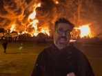 The viral video reportedly shows the Iranian journalist reporting near a massive blaze at an oil depot in Iran. The viral video reportedly shows the Iranian journalist reporting near a massive blaze at an oil depot in Iran.