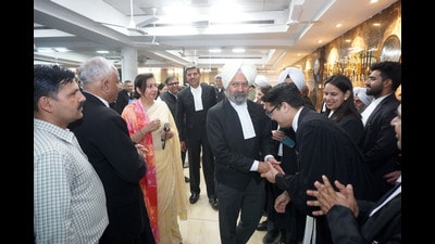 Justice Anupinder Singh Grewal with his wife Ashooneet Kaur and chief justice Sheel Nagu at the farewell function organised by the Punjab and Haryana High Court Bar Association at high court on Monday. Justice Anupinder Singh Grewal with his wife Ashooneet Kaur and chief justice Sheel Nagu at the farewell function organised by the Punjab and Haryana High Court Bar Association at high court on Monday.