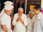 Congress leader Rahul Gandhi and Rohtak MP Deepender Hooda with farmer Sanjay Kumar (second from left) in Sonepat’s Madina village on Tuesday to attend the wedding of his daughter. (HT Photo)