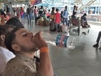 Ludhiana, India – June 05, 2019 : A passenger quenches his thirst with Rail Neer bottle at Railway Station in Ludhiana on Wednesday, June 05, 2019. (HT Photo)
