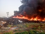 Officials said large quantities of plastic, rubber and scrap fuelled the blaze while pollution board was asked to trace source industries. (HT Photo)