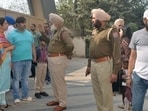 Police assuring anxious parents outside a school in Ludhiana after it received a bomb threat on Tuesday morning. (Gurpreet Singh/HT)