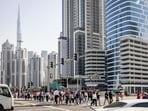 Pedestrians in the Business Bay financial district of Dubai, United Arab Emirates.