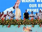 Prime Minister Narendra Modi waves during the Golden Jubilee Sammelan of Akhila Kerala Dheevara Sabha, in Ernakulam on Wednesday.