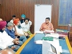 Additional deputy commissioner (general) Poonam Singh conducting a meeting with representatives of LPG gas agencies and oil companies regarding the current supply situation in Ludhiana on Tuesday. (HT Photo)