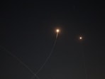Rocket trails are seen in the sky above the Israeli coastal city of Tel Aviv amid a fresh barrage of Iranian missile attacks on March 10.